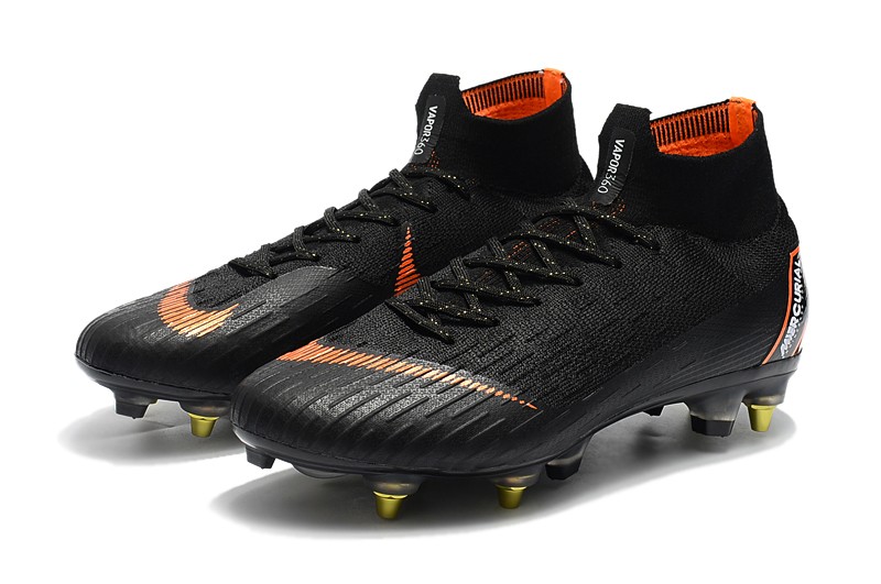 black and orange nike cleats