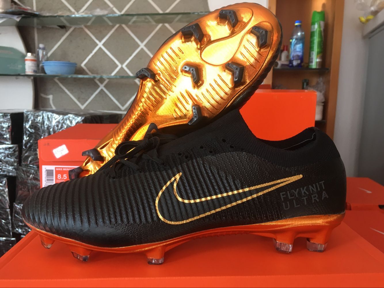 nike flyknit black and gold football boots