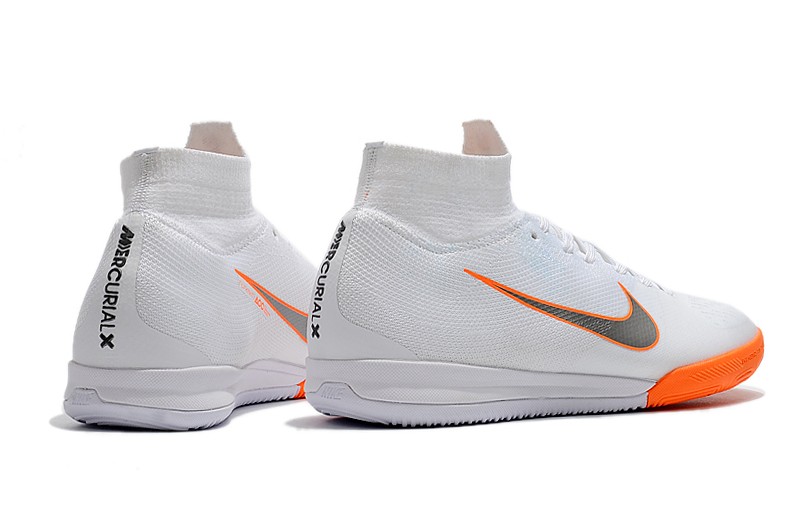 white nikes with orange heel
