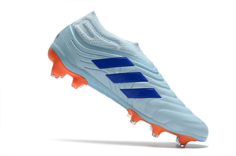 white and blue football boots