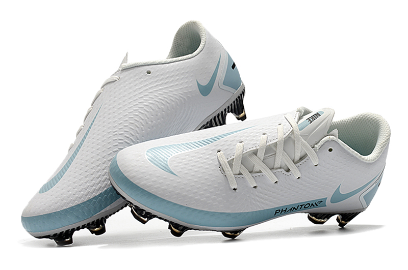 white and blue football boots